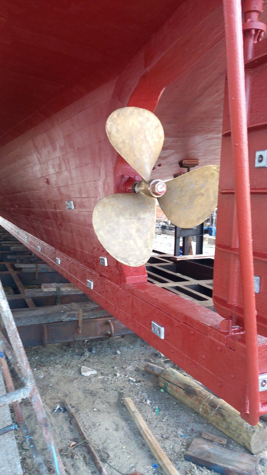 Bronze propeller and freshly coated hull on the slip